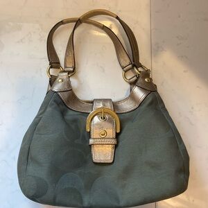 Coach handbag olive green with gold accents and buckle.